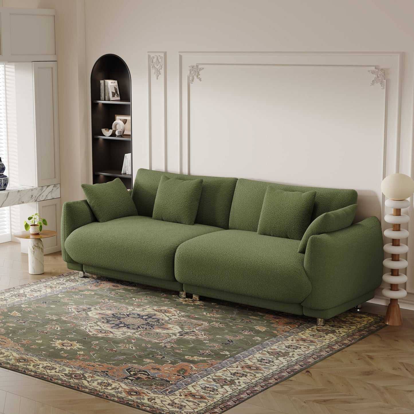 An 86.6-inch teddy wool green sofa with four throw pillows and hardware feet that can sit comfortably in an apartment bedroom wi